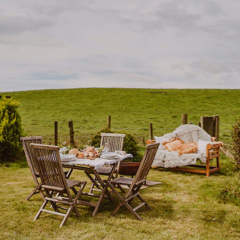 Dine alfresco on the lawn with fields as far as the eye can see