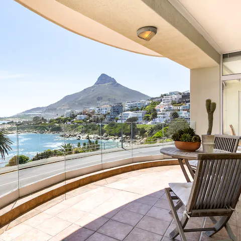 Sit out on your own private balcony with stunning mountain and ocean views