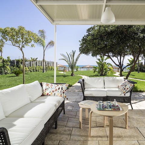 Chill on the terrace sofas, supported by a gorgeous view of the sea