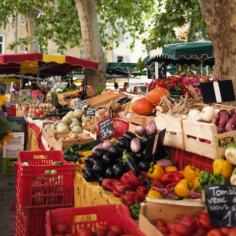 Stock up on fresh seasonal fruit and vegetables at the weekly market
