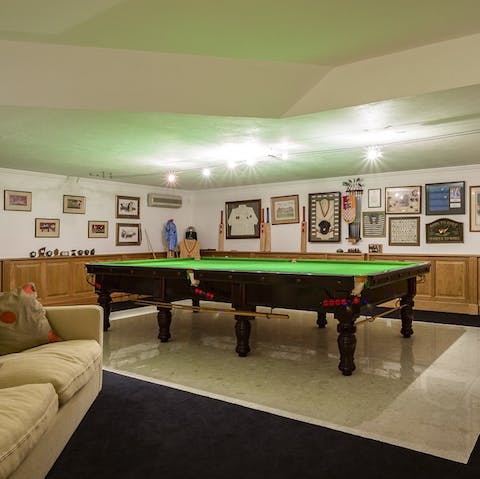 Get competitive in the games room, decked out with all sorts of sporting memorabilia
