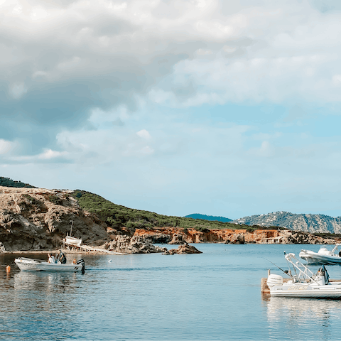 Head down to the pebbly cove of Cala Molí, it's a good walk or a short drive away