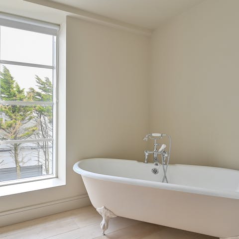 Soak awhile in the nickel roll-top bath of the main suite, complete with king-sized bed