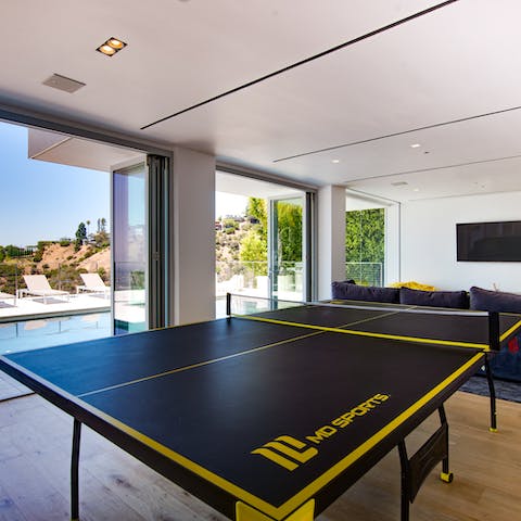 Get a game of table tennis going in the games room
