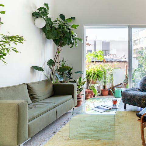 Sip a glass of wine in your indoor jungle or take it out onto the leafy balcony
