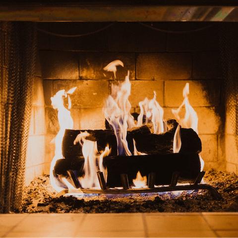 Spend cosy evenings snuggled up beside the wood-burning fireplace