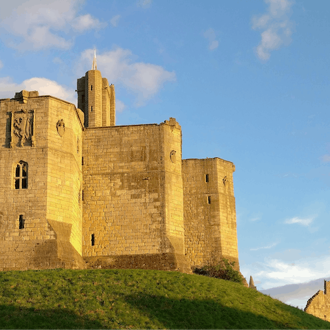 Visit Warkworth Castle, a thirty-minute walk from your doorstep