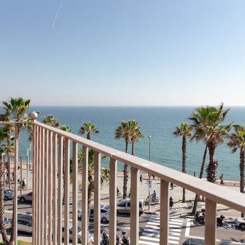 Sit out on your private balcony overlooking the beach