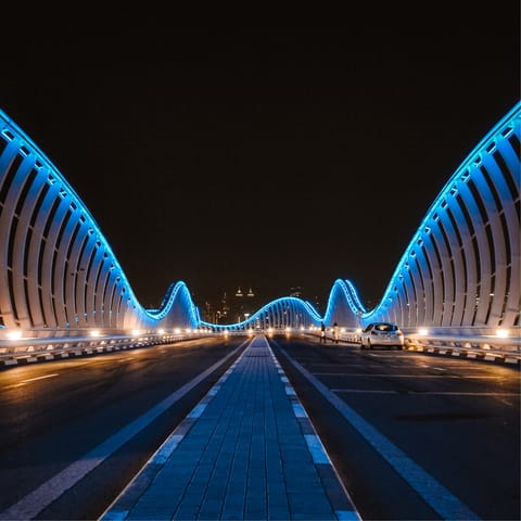 Take a drive across the futuristic Meydan Bridge,  it's ten minutes away