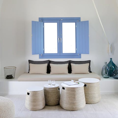 Fall in love with the curved Cycladic architecture and minimal Grecian design