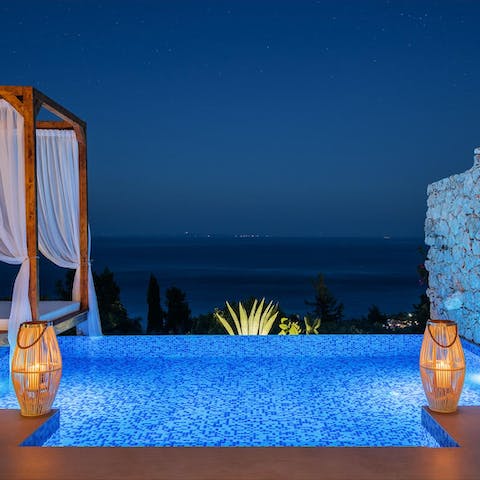 Slip into the sparkling waters of your infinity pool for a late-night dip