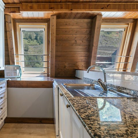 Prepare meals in your well-equipped kitchen, all the while enjoying views of the mountains
