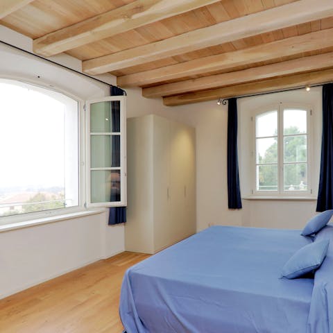 Throw the windows open to gaze out as you enjoy coffee in bed