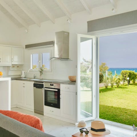 Enjoy views of the sea and the lush garden from this cosy home