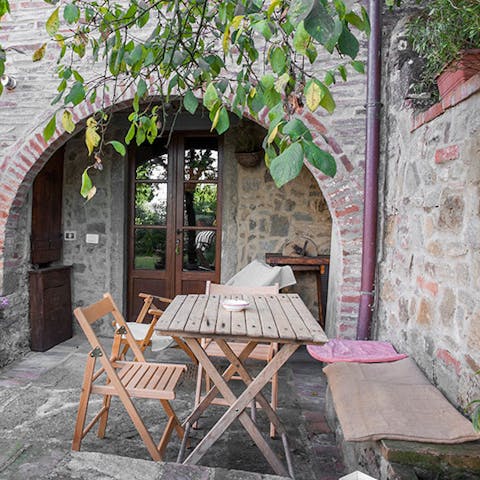 Sit down to outdoor dining in the dappled shade of a tree