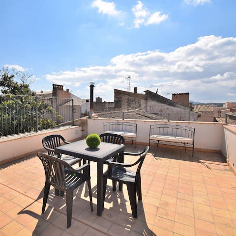 Take in the views over the rooftops of Artá from the roof terrace