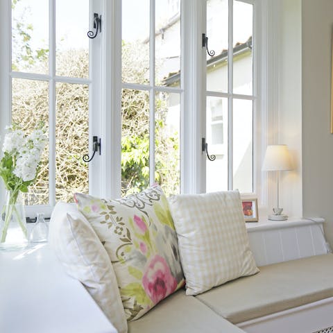 Curl up with an engrossing book in the charming window seat