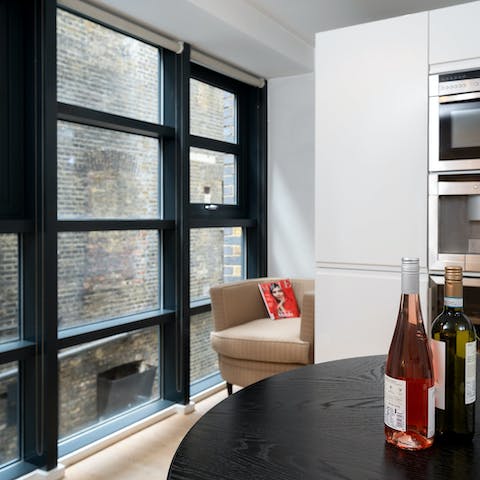 Open a bottle of chilled wine as you dine by the huge  windows