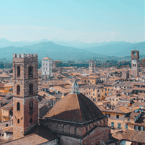 Explore the historic town of Lucca, home to cobblestone streets, preserved Renaissance walls and impressive squares