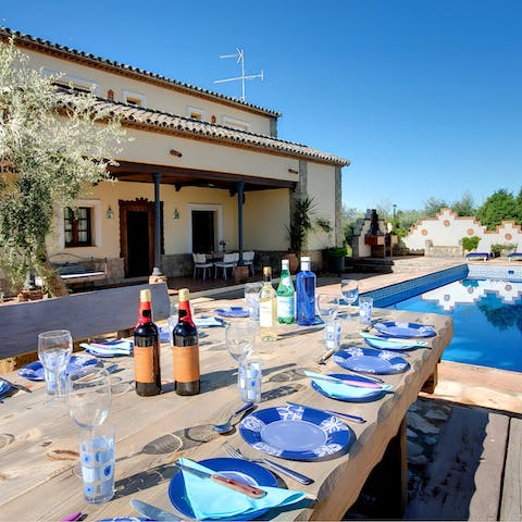 Share some Spanish wine and delicious meals in the outdoor dining area 