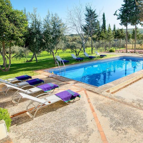 Relax and work on your tan by the private pool