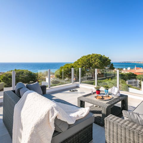 Relax on the roof terrace with a glass of wine and drink in the Atlantic Ocean views