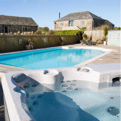 Spend long summer days relaxing by the shared outdoor pool