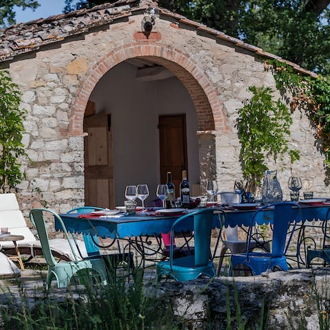 Enjoy an Italian feast at the dining area in the private garden