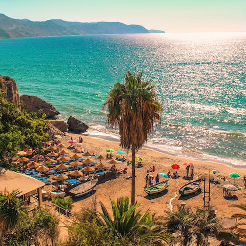 Hang out on Carabeo Beach, a ten-minute drive away