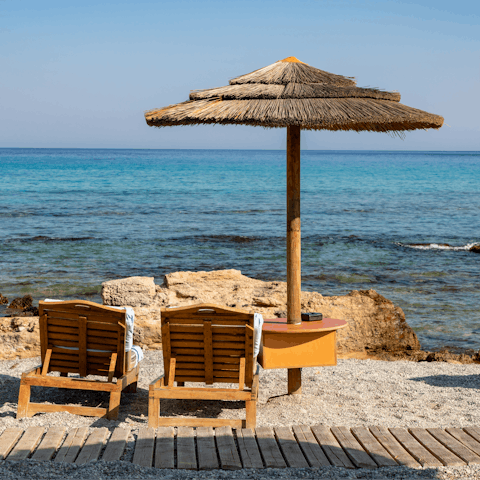 Drink up the sea air at Kalathos Beach, just 400-metres away