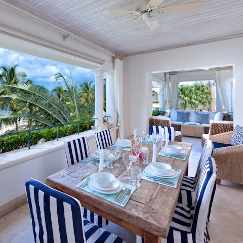 Bask in a warm breeze as you tuck into Bajan cuisine on the covered terrace