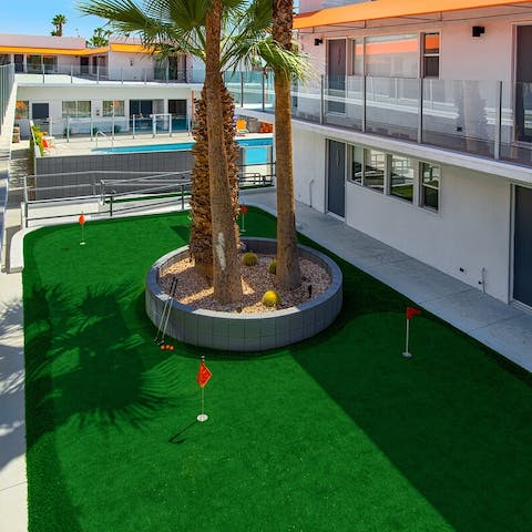 Work on your putting on the practice green before heading to Escena Golf Club