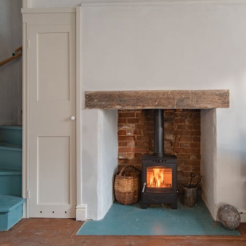 Get toasty beside the wood-burner fire