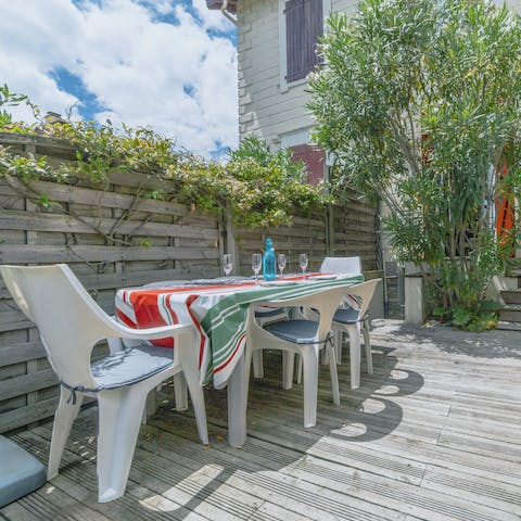 Gather for evening drinks on the greenery-filled terrace