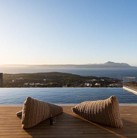 Settle down on the plush chairs and watch the sunset over the bay