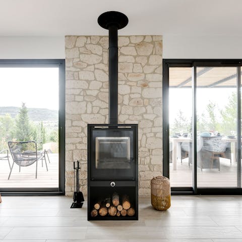 Keep cosy by the wood burner in the homely living area
