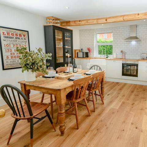 Bond over a big family dinner in the stylish open plan kitchen