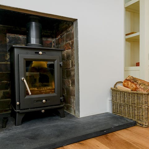 Snuggle up by the log fire after a day of exploring in the countryside