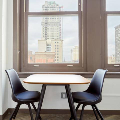 Enjoy breakfast with a view of the city's skyscrapers through the large windows