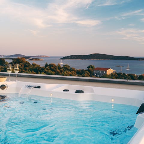 Unwind in the Jacuzzi on the terrace as the sun is setting