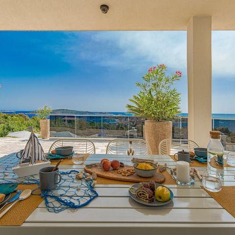 Dine alfresco and admire the stunning sea views