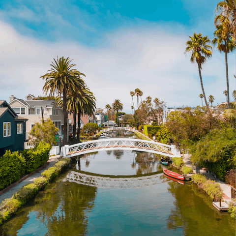 Stroll along the picturesque Venice Canals, a short ten-minute walk from your doorstep