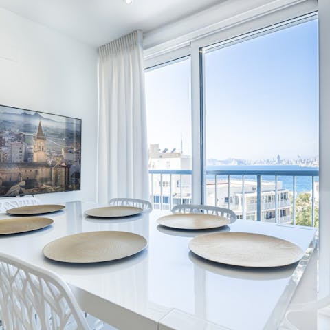 Share delicious tapas at the dining table with those sea vistas outside 