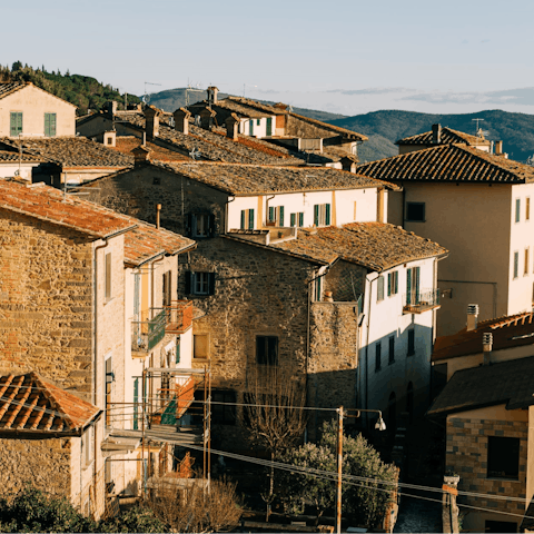 Explore Cortona, an artsy hilltop village with an interesting history just a ten-minute drive away
