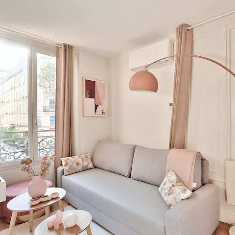 Settle down in the pastel-pink living area with a glass of French wine