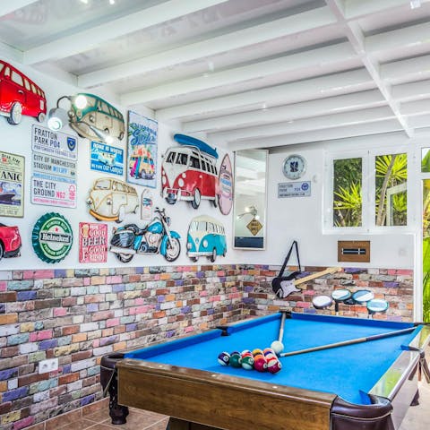 Play some pool in the games room with its VW Camper van art