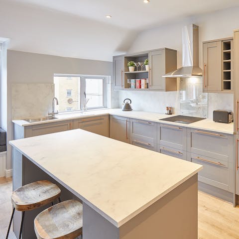 Prepare a meal or enjoy a glass of wine together in this sociable kitchen area