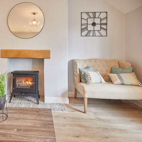 Cosy up by the fire in this inviting seating area