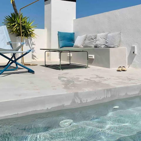 Slip into the plunge pool and look out over the town towards the sea