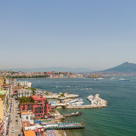 Relax on the golden sands of Spiaggia delle Monache in Posillipo, a three-minute walk away